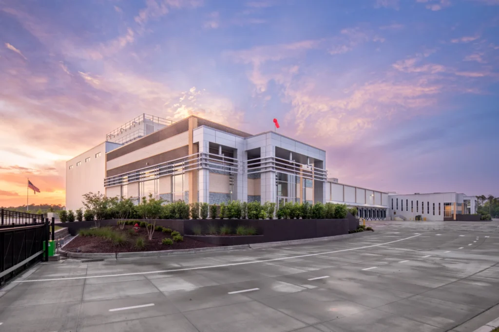 Cold Summit Development facility in Wilmington with aluminum sunshades at sunset